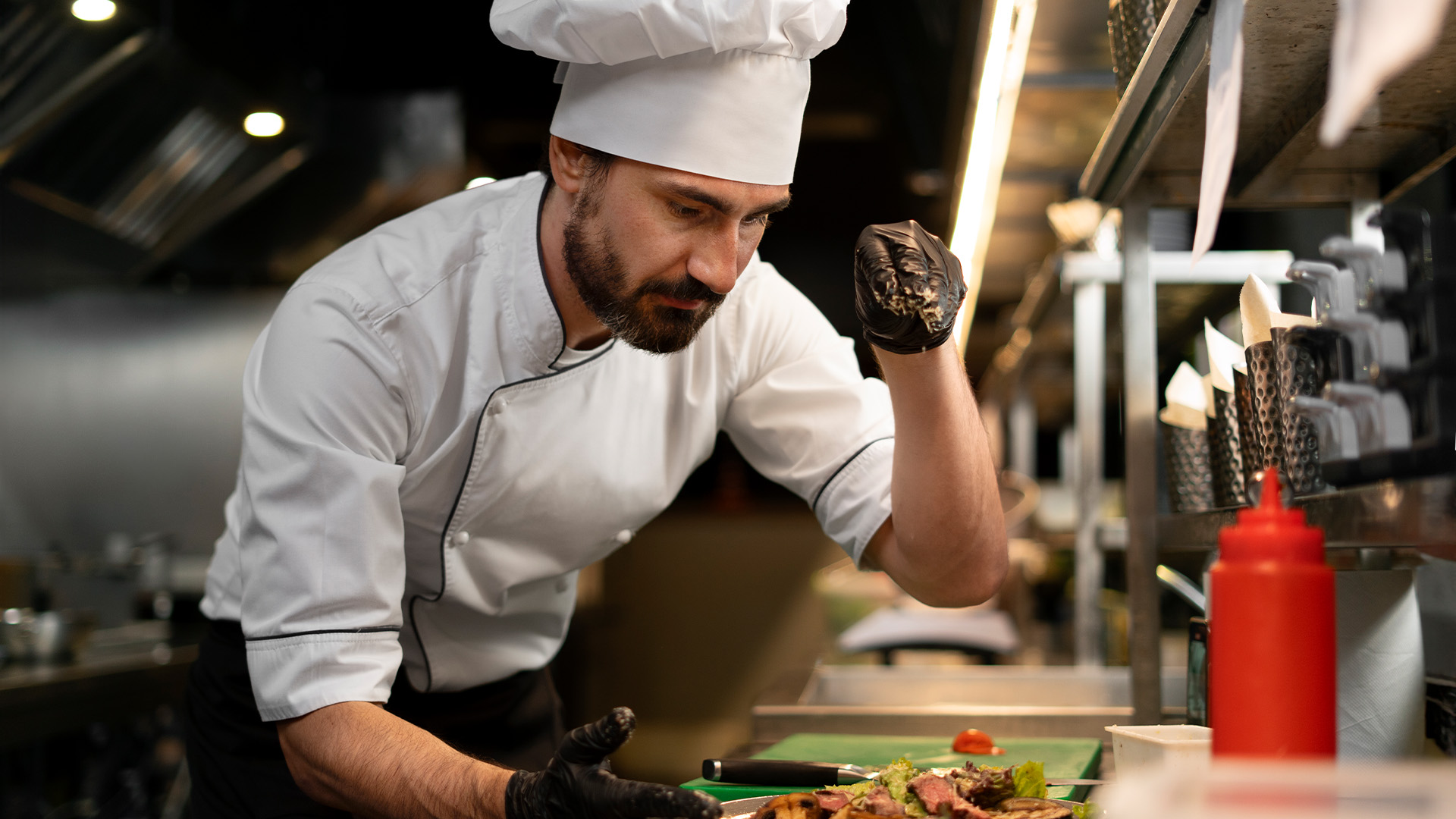 chef cooking kitchen while wearing professional attire